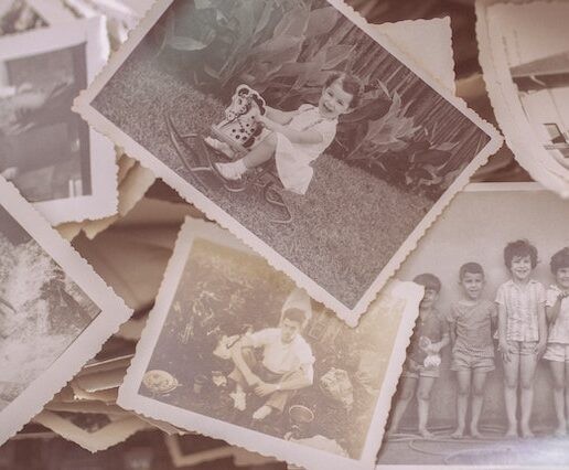Old black and white photos of children and family. These would be perfect displayed near a custom Amish clock